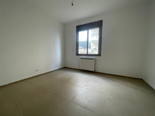 GMK234Y - Apartment For Sale In Ballouneh - شقة للبيع في بلونة